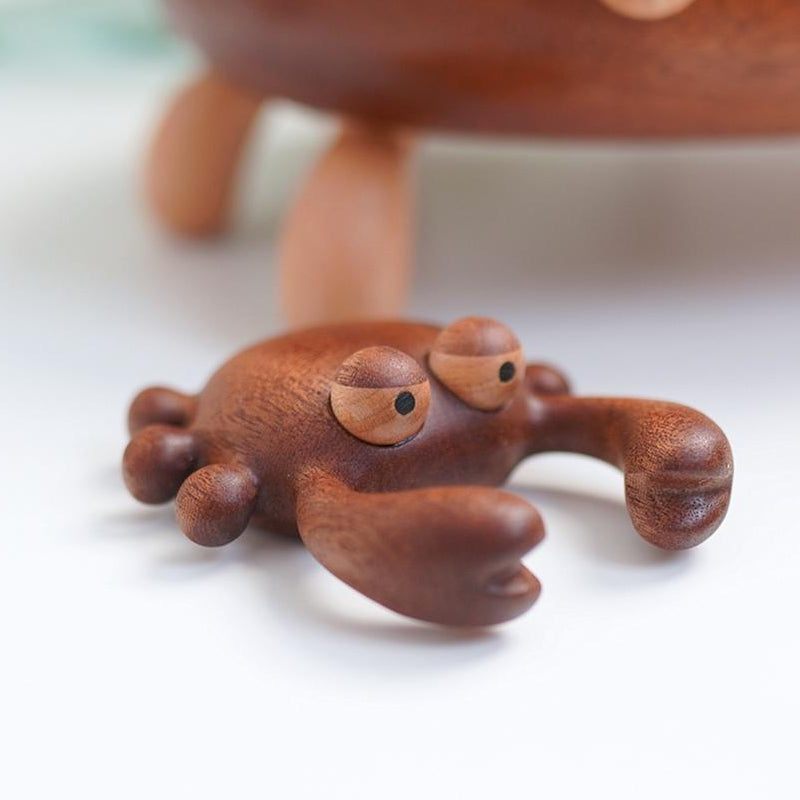 Pipimu handcrafted wooden crab massager made from black walnut and maple.