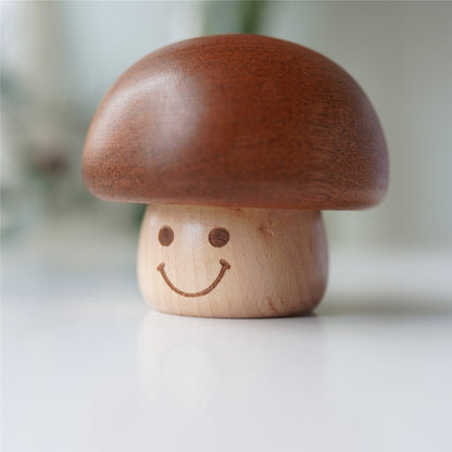 Close-up of handcrafted smiling mushroom music box