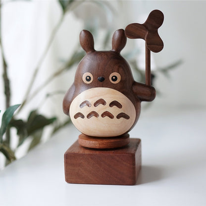 Pipimu wooden music box base with forest spirit figurine on top, versatile ebony display stand