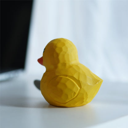 Back view of yellow duck wood carving figurine