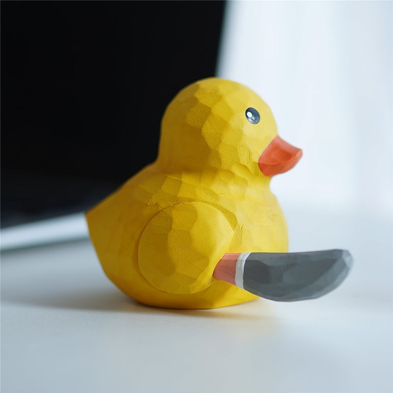 Funny wooden duck ornament with knife side view