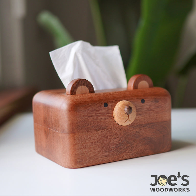 Side angle of the cute wooden bear tissue box with tissues popping out