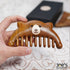Front view of handcrafted bear wood comb with wide teeth