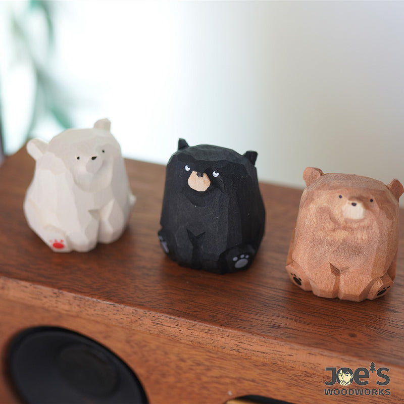 Trio of handcrafted wooden bear figurines on display – cute animal desk decor