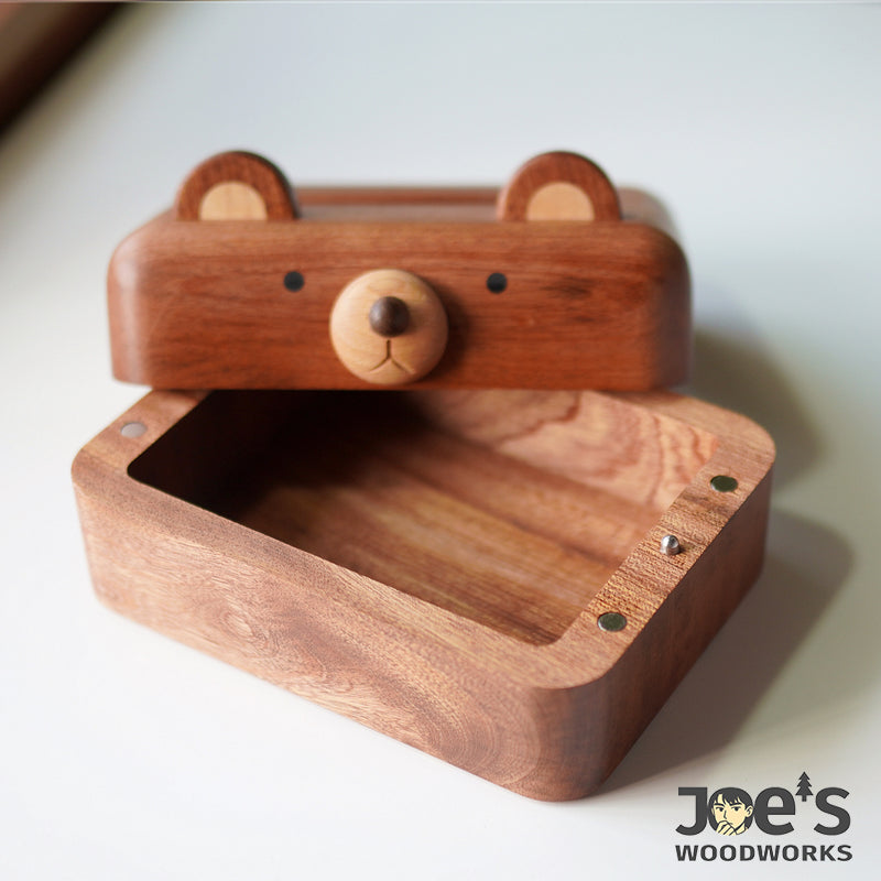 Inside view of bear-shaped wooden tissue box with open lid