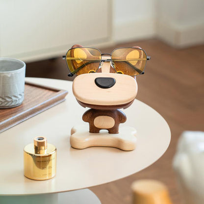 Close-up of wooden dog phone stand showing fine wood grain
