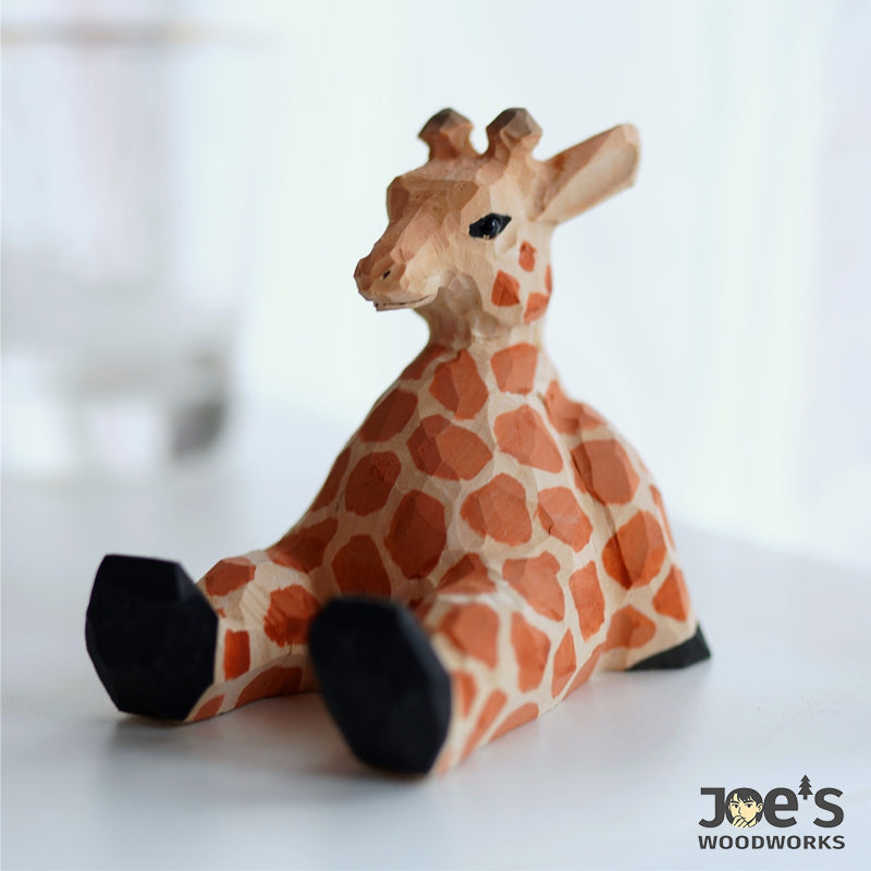 Hand-carved wooden giraffe phone stand by Joe’s Woodworks, playful and functional decor