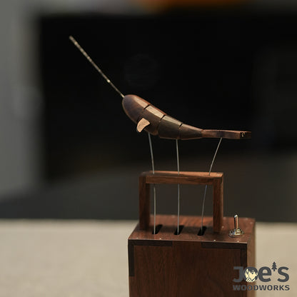 Side angle of handcrafted whale automaton in motion